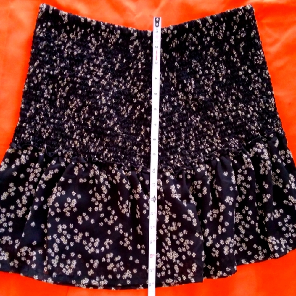black mini skirt with floral print